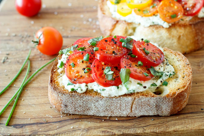 tomato basil ricotta and spinach crostini